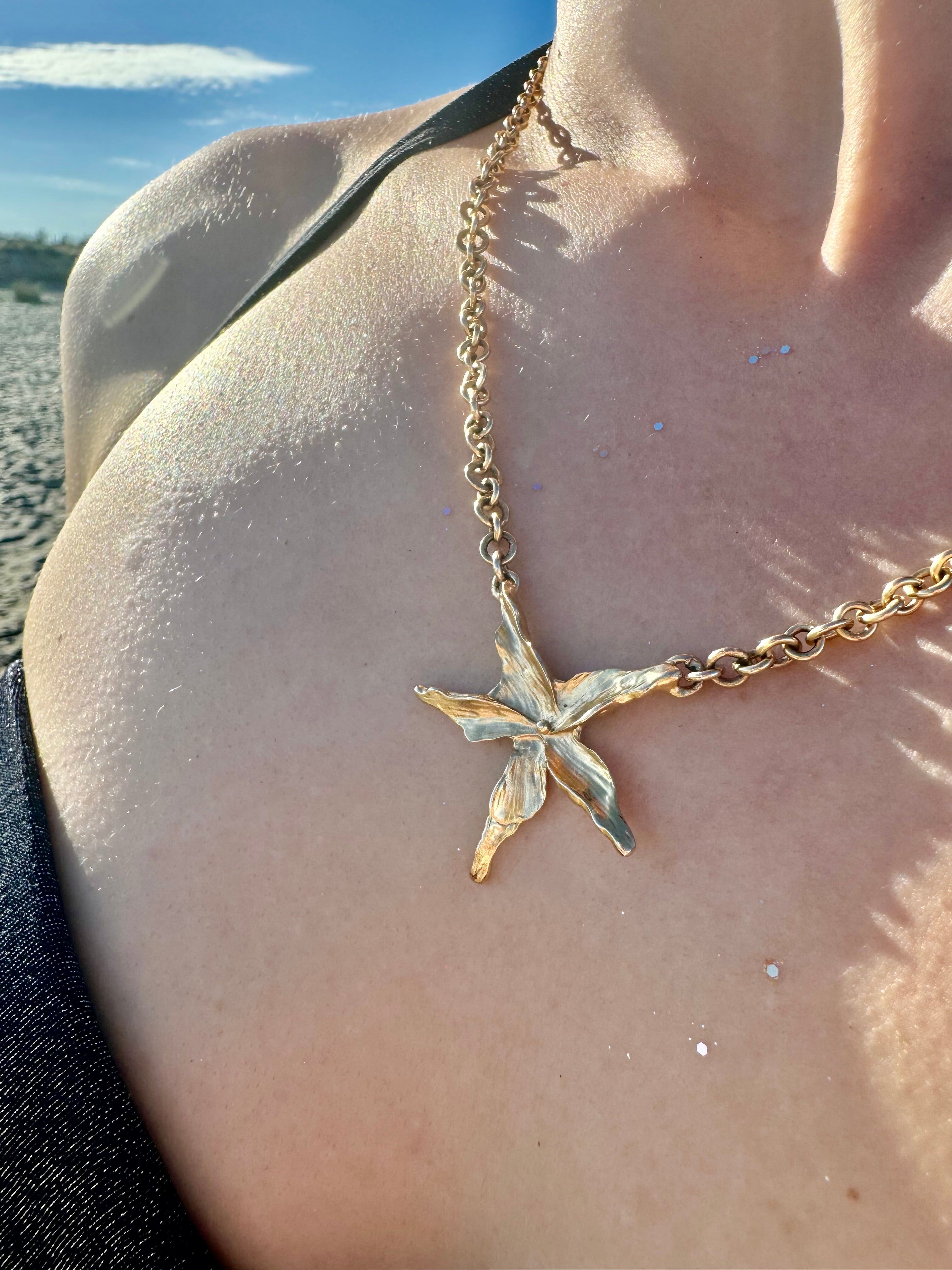 Star Flower Necklace — Sculptural pendant in gold-plated brass, handmade in France