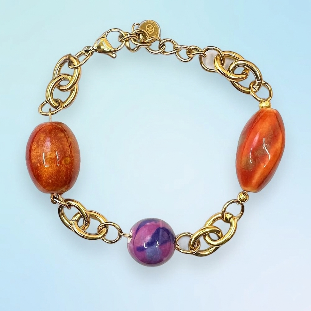 Bracciale in acciaio placcato oro con perline in ceramica
