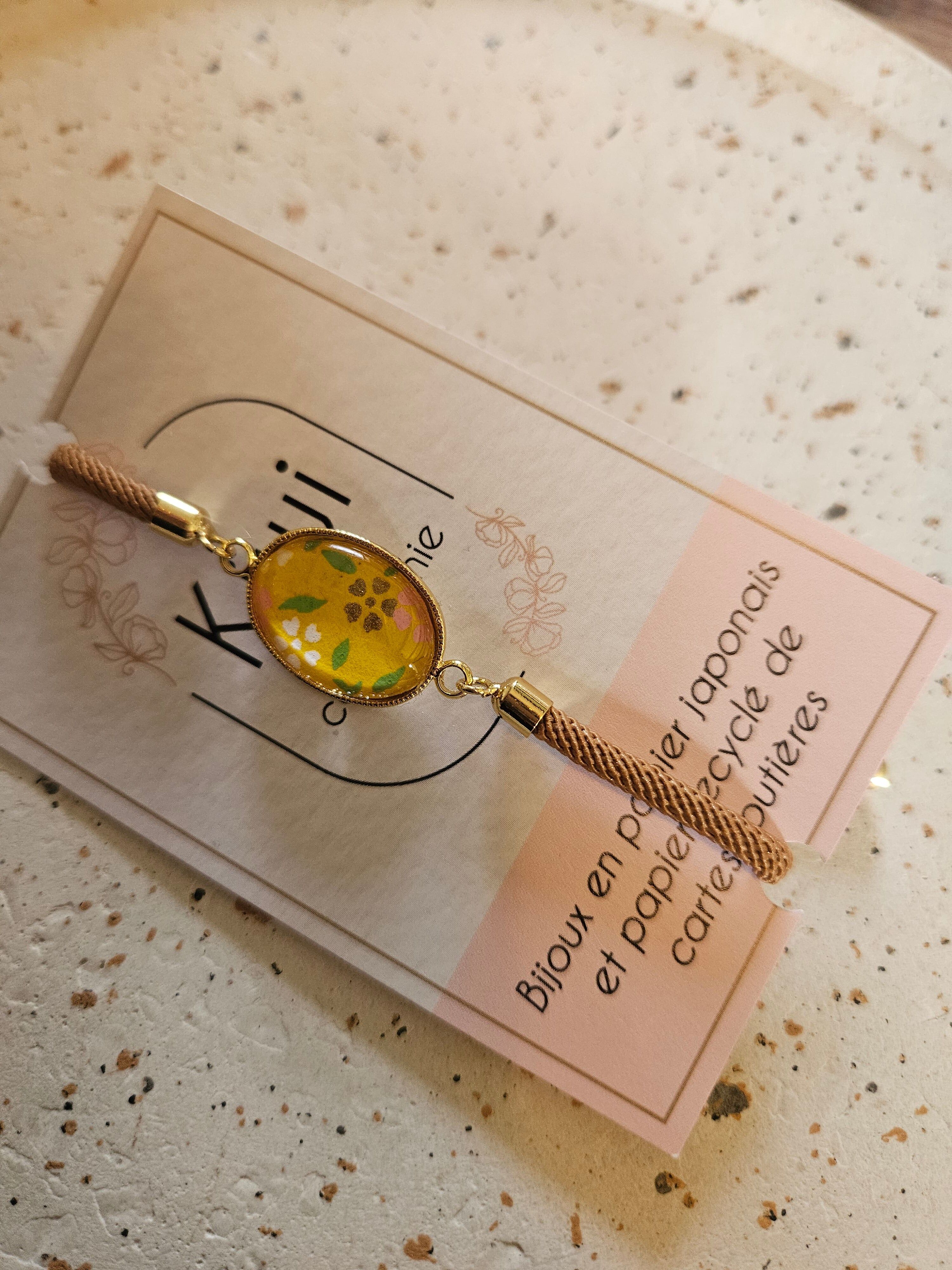 Adjustable brown cotton bracelet - yellow cabochon - oval - white flower with a touch of green