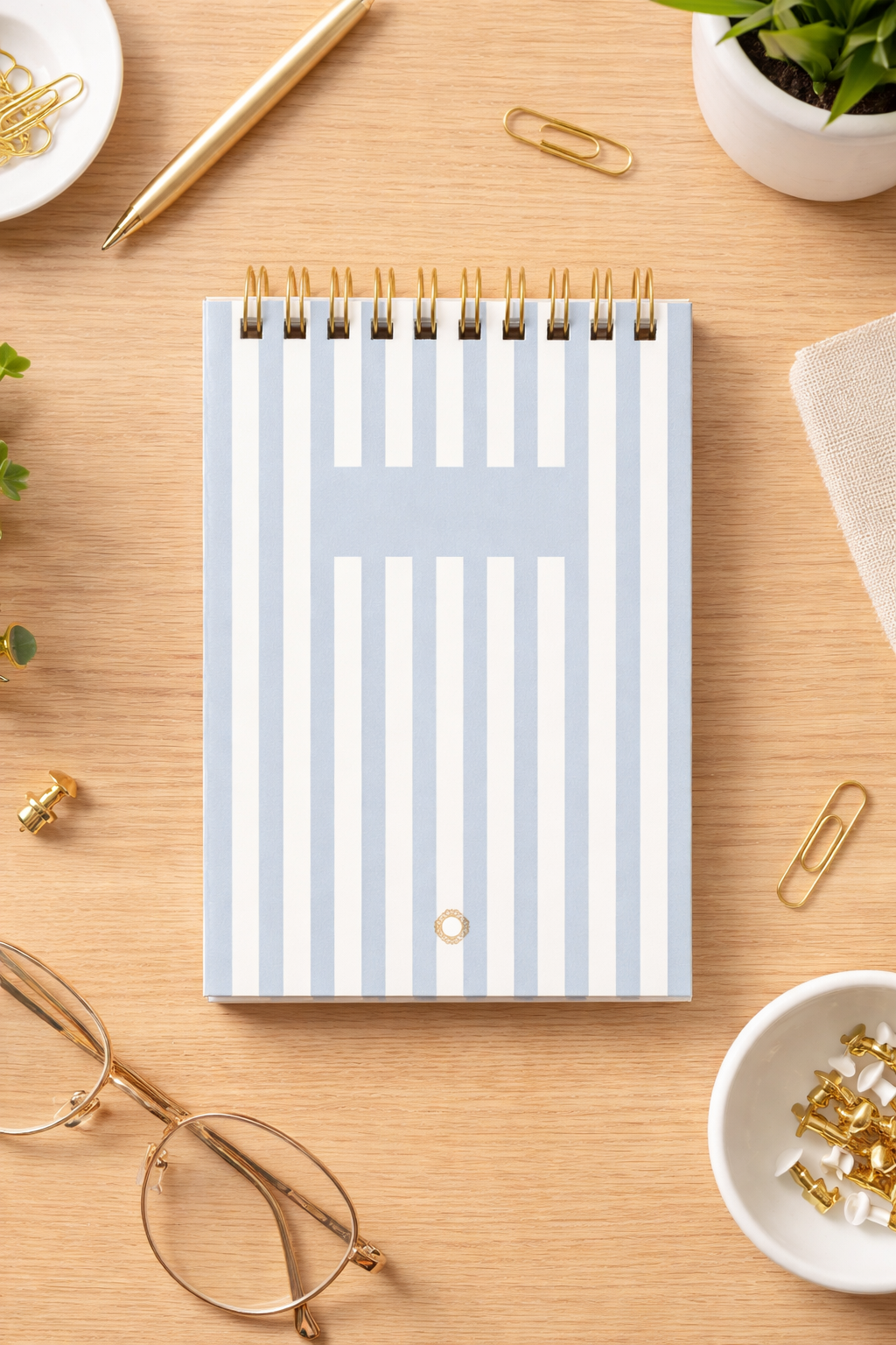 A6 spiral notebook – Laid paper with blue stripes, dark gold spiral binding – 80g ivory paper (150 pages)