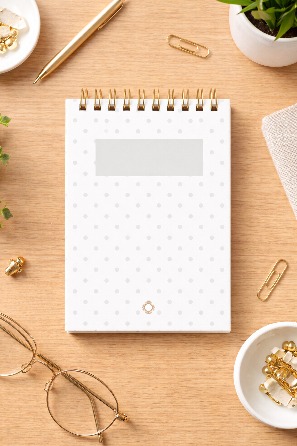 A6 spiral notebook – Laid paper with grey polka dots, dark gold spiral binding – 80g ivory paper (150 pages)