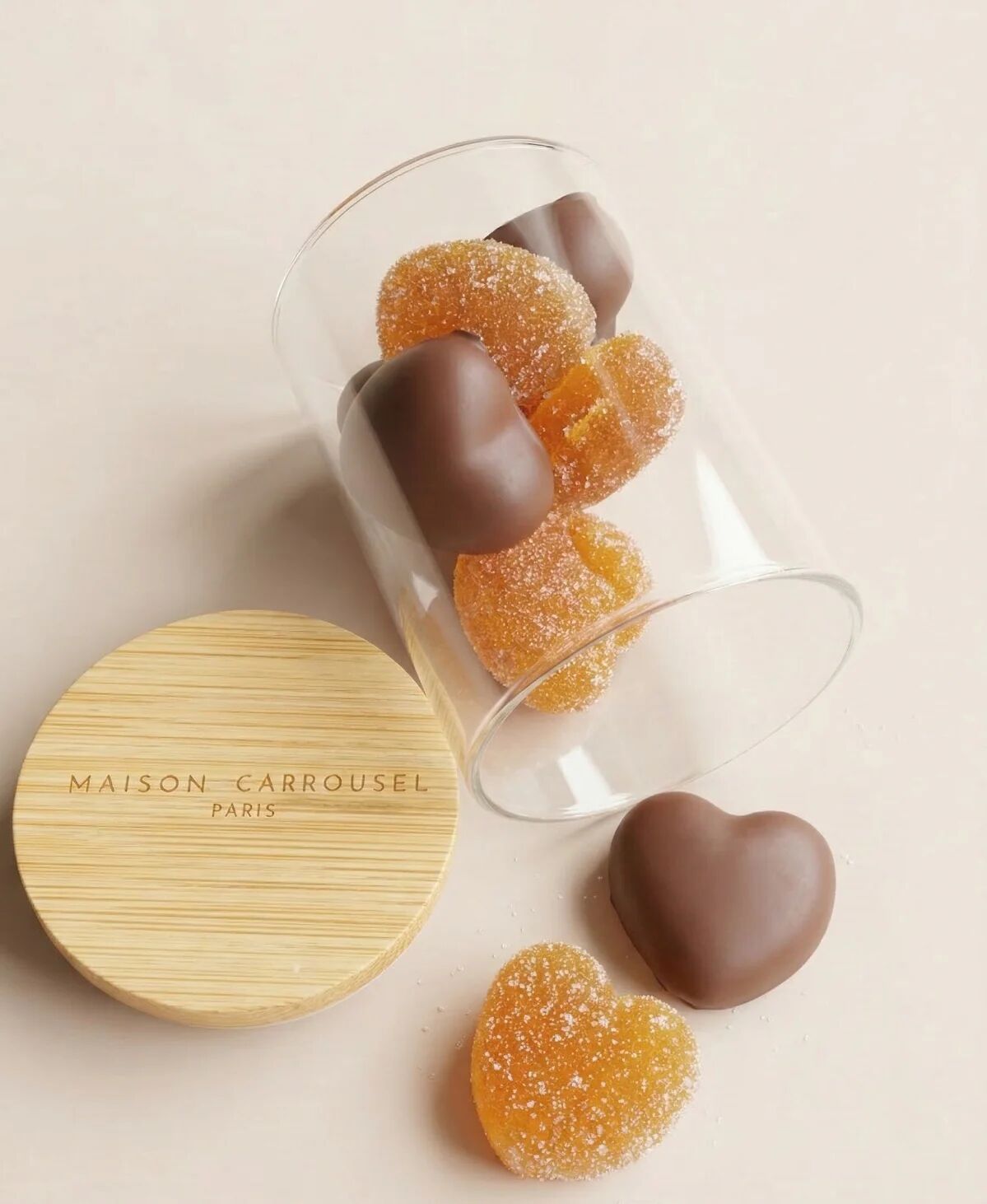 Small fruity and chocolate hearts in a candy jar