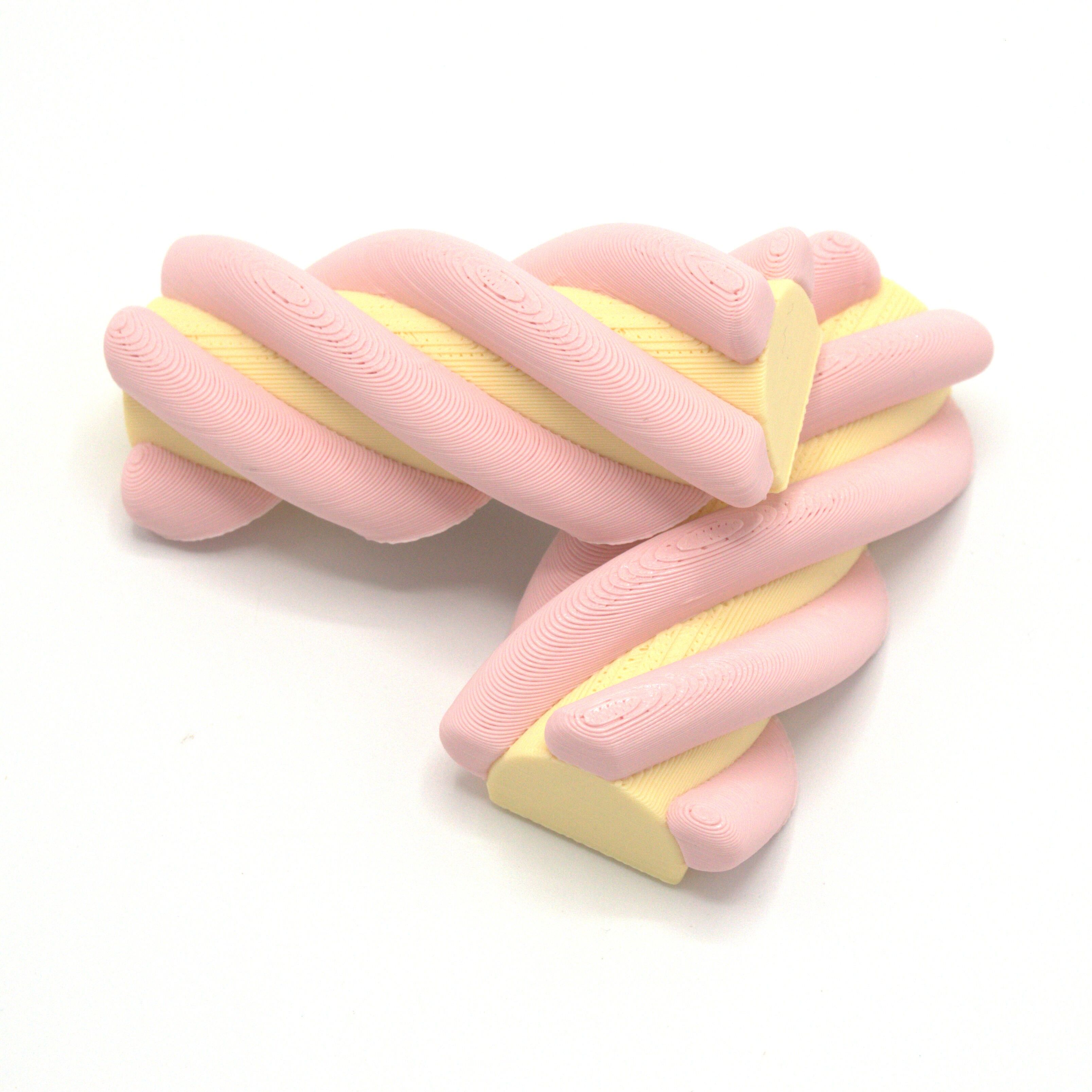 Bonbon magnétique, torsadé rose-jaune