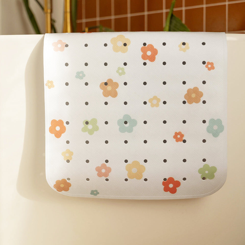 Alfombrilla de baño con estampado floral.