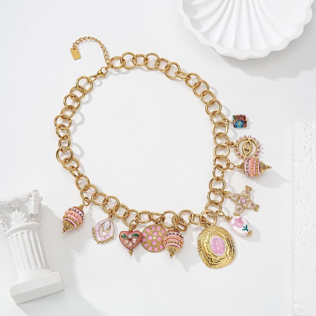 Gold chain necklace with fancy charms