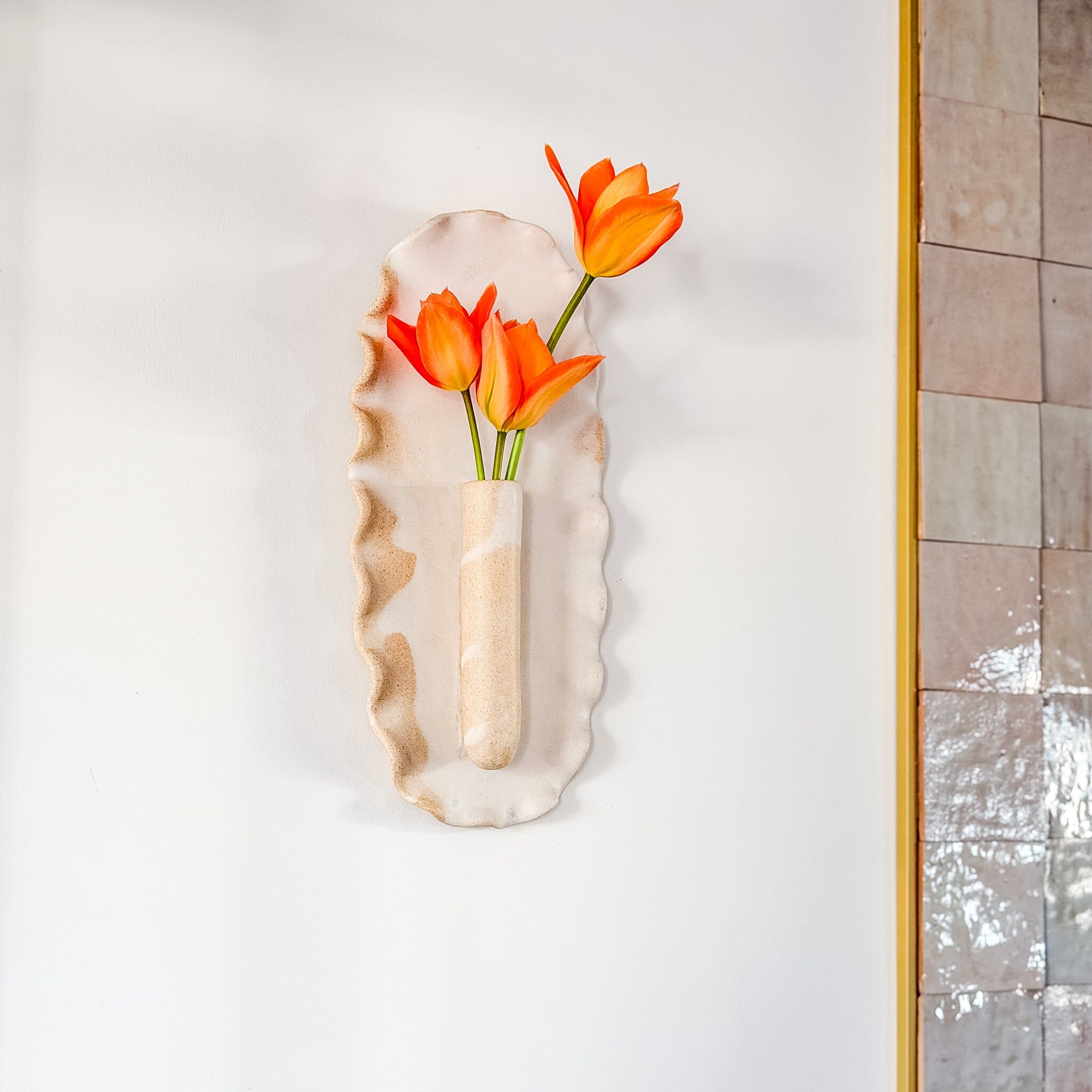 white wall-mounted bud vase