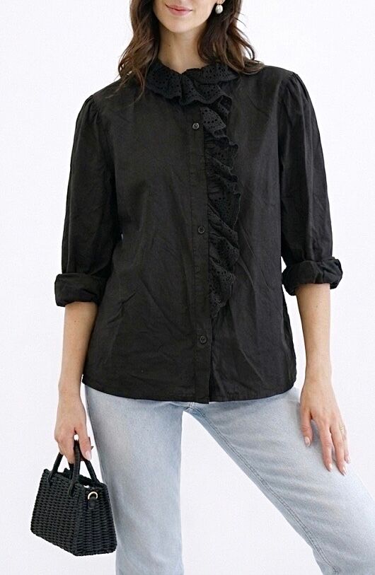 Long-sleeved shirt with a wide, frilly, openwork broderie anglaise trim at the neckline and extending down the length