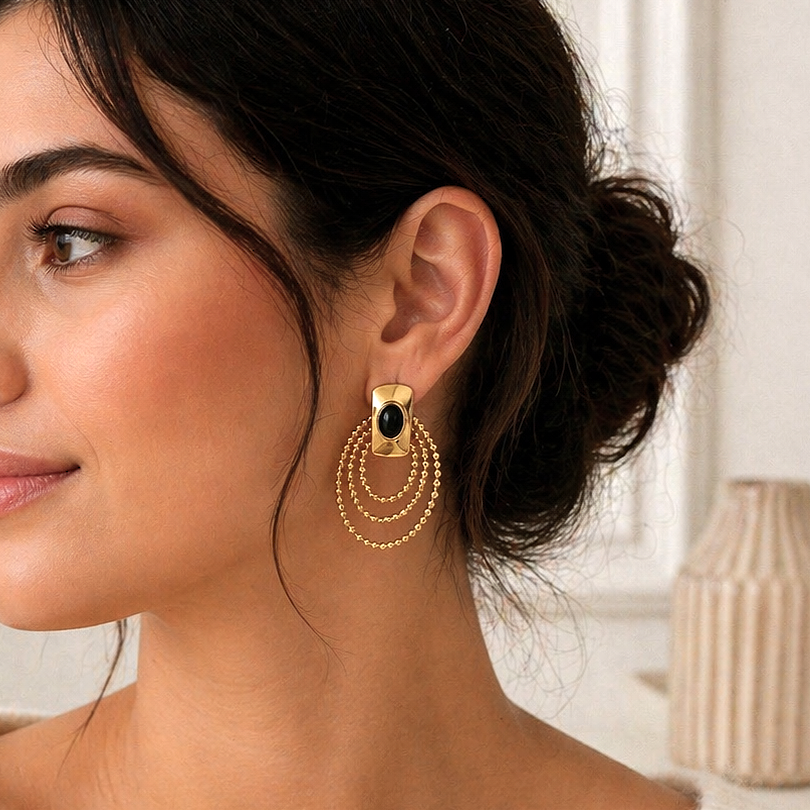 Gold earrings with colored stone