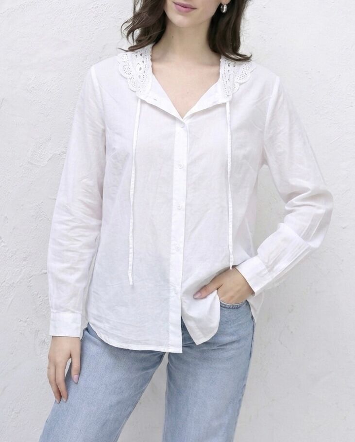 Long-sleeved shirt with buttoned cuffs, ruffled collar adorned with eyelet embroidery, V-neck with two tie straps