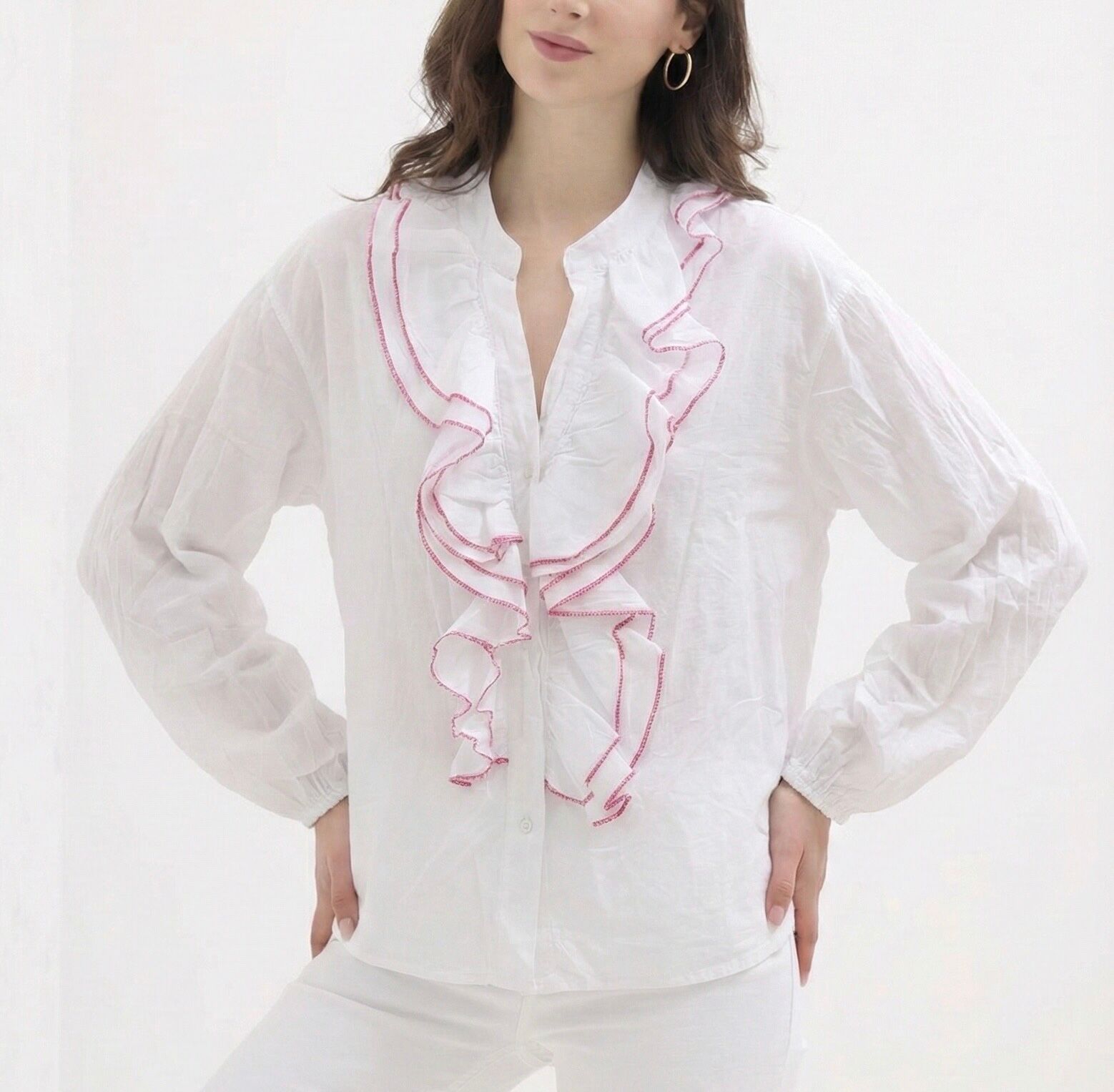 Long-sleeved shirt with elasticated cuffs, mandarin collar, and a bib adorned with large cascading ruffles enhanced with colorful embroidered trim.