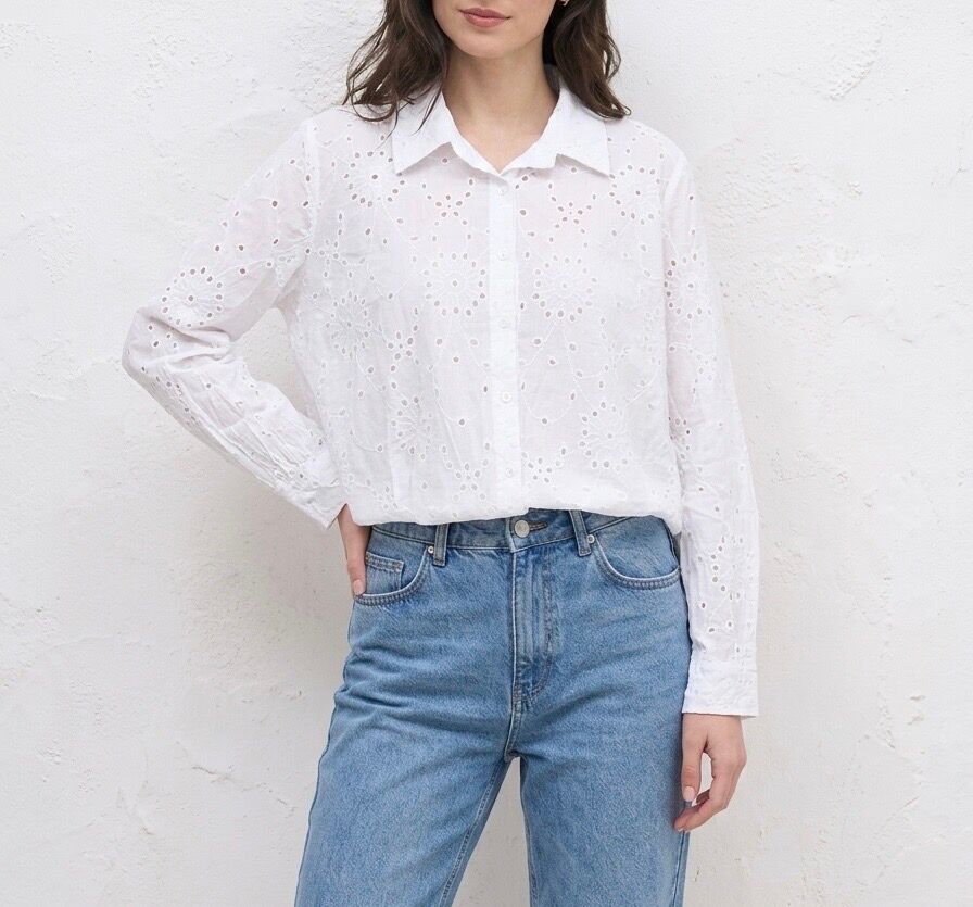 Loose-fitting, long-sleeved shirt with buttoned cuffs and an all-over floral pattern in openwork eyelet embroidery.