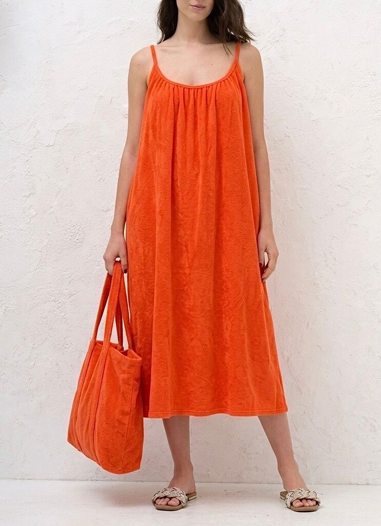 Mid-length, loose-fitting beach dress in soft terry cloth with a plunging round neck and thin straps.