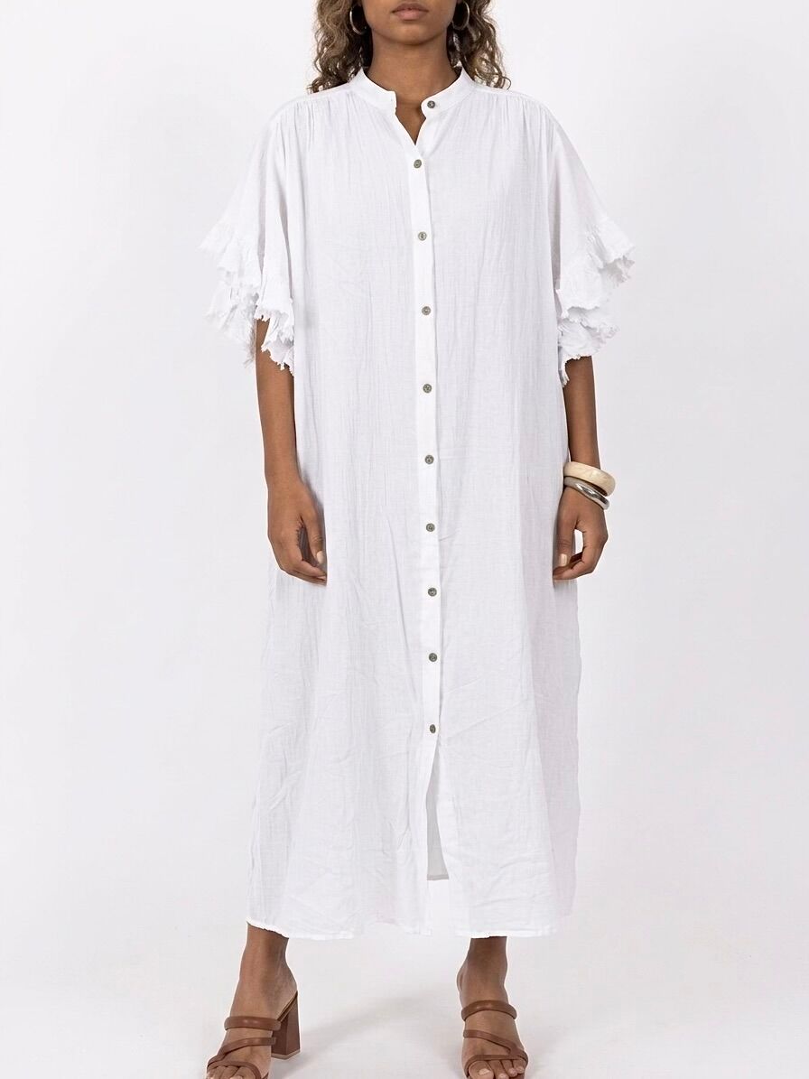 Bohemian long loose-fitting shirt dress with a Mao collar, wide sleeves adorned with tiered ruffles, and raw-edged finishes.