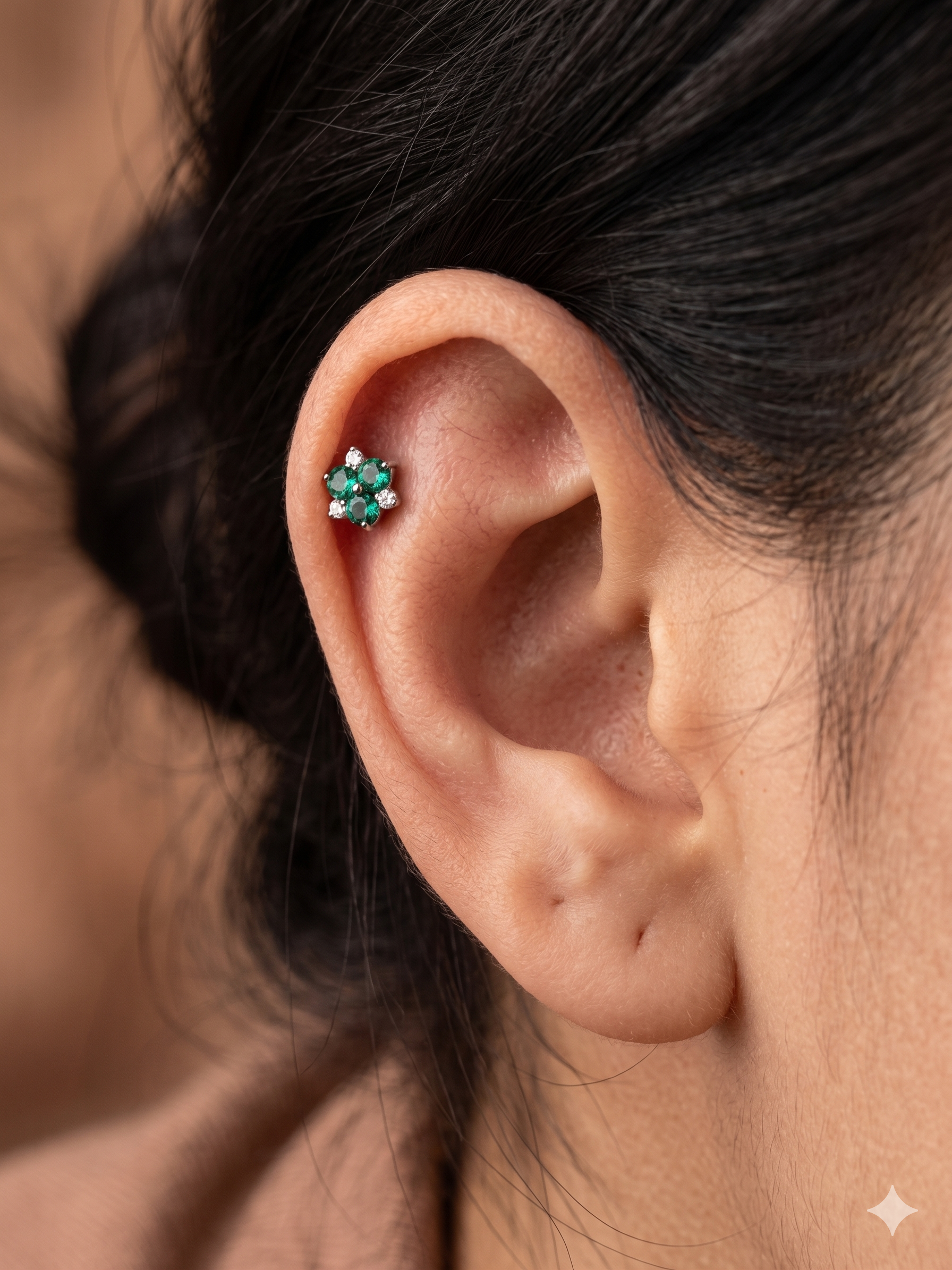 Green flower piercing with white rhinestones in titanium