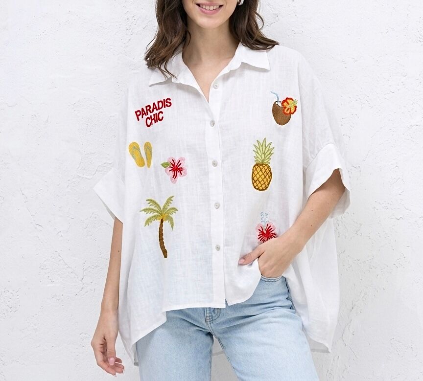 Loose-fitting, short-sleeved shirt with dropped and beautifully detailed armholes finished with wide, colorful summer embroidery on the lapels