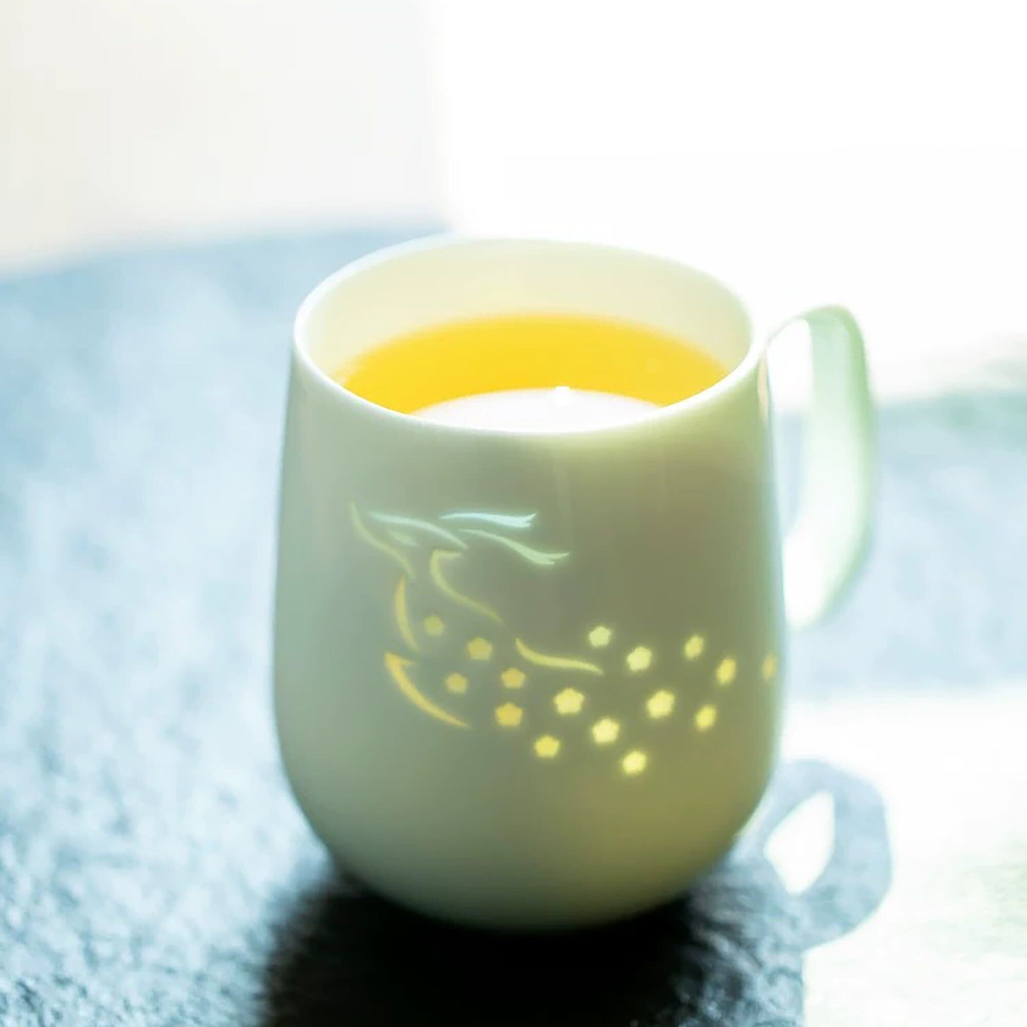 Translucent style porcelain mug with a celestial deer motif
