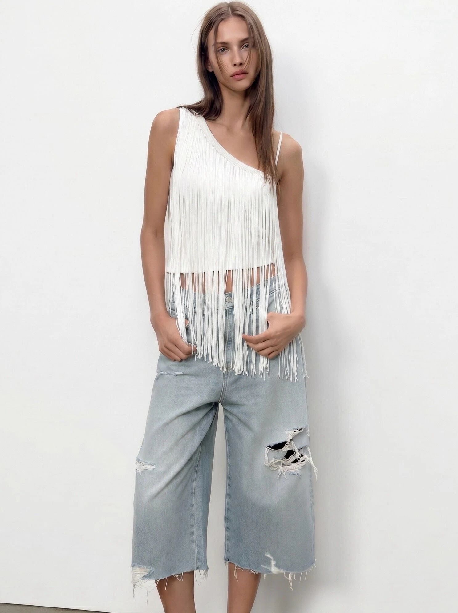 Asymmetrical fringed sleeveless top