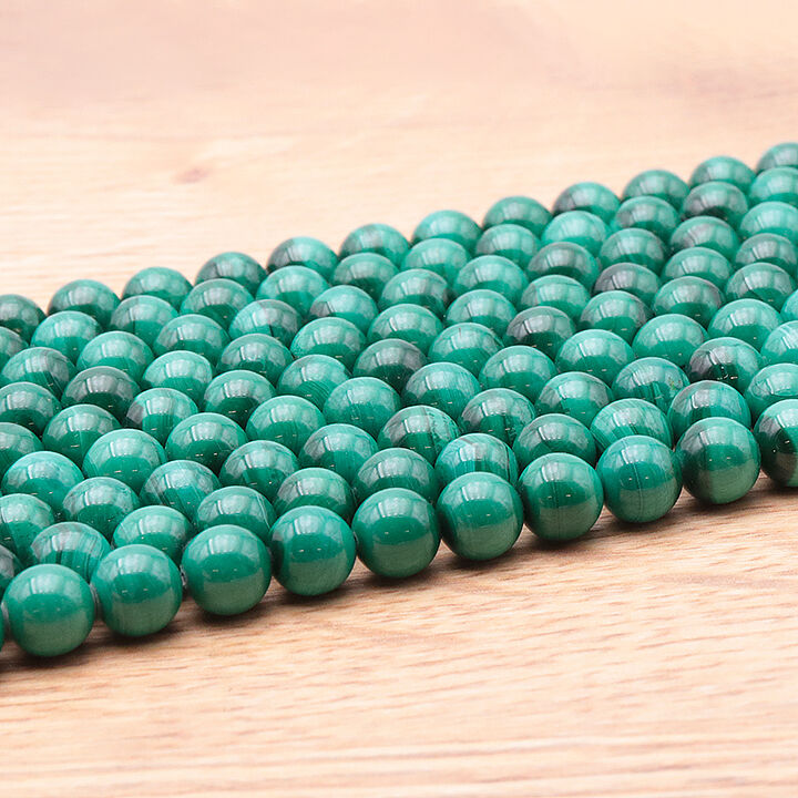 06mm clear malachite AA bead strand