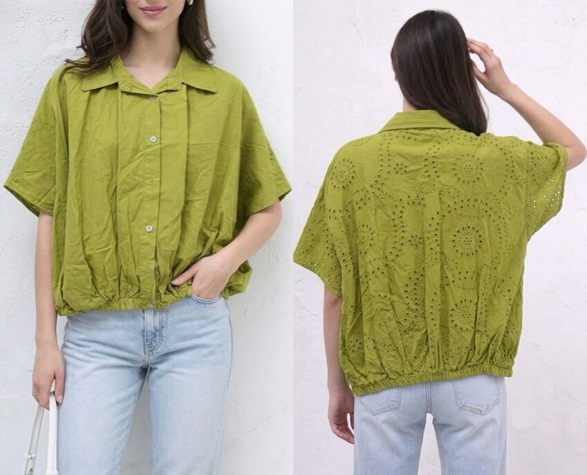 Shirt with dropped sleeves, elasticated and gathered waist, and a back entirely decorated with openwork eyelet embroidery.
