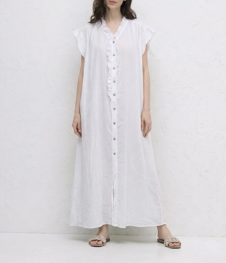 A loose-fitting, straight maxi dress with short sleeves and small ruffles highlighting the neckline and extending along the button placket.
