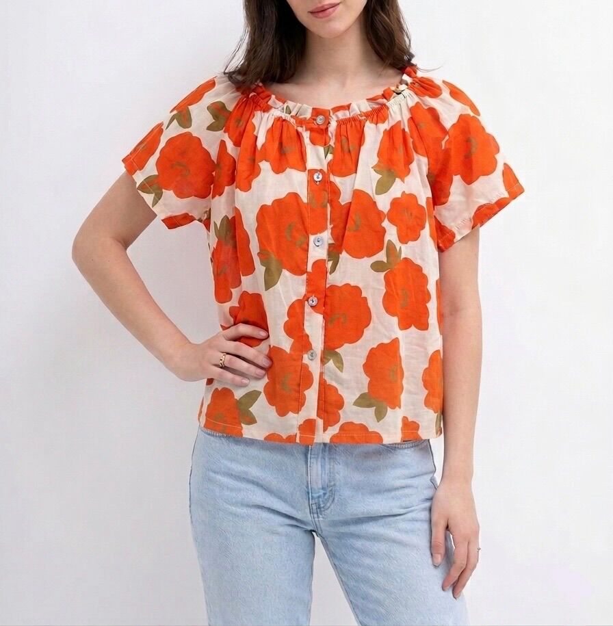 Short-sleeved shirt with a rounded, gathered neckline and floral pattern