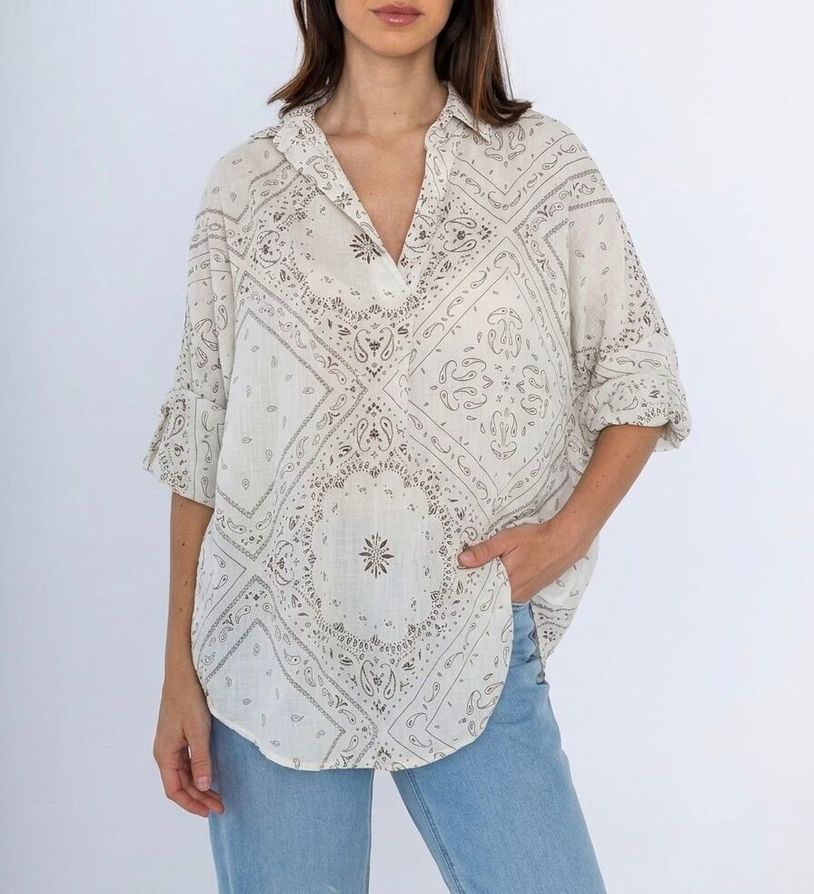 Loose-fitting bohemian blouse with long sleeves, shirt collar, and Paisley Bandana print