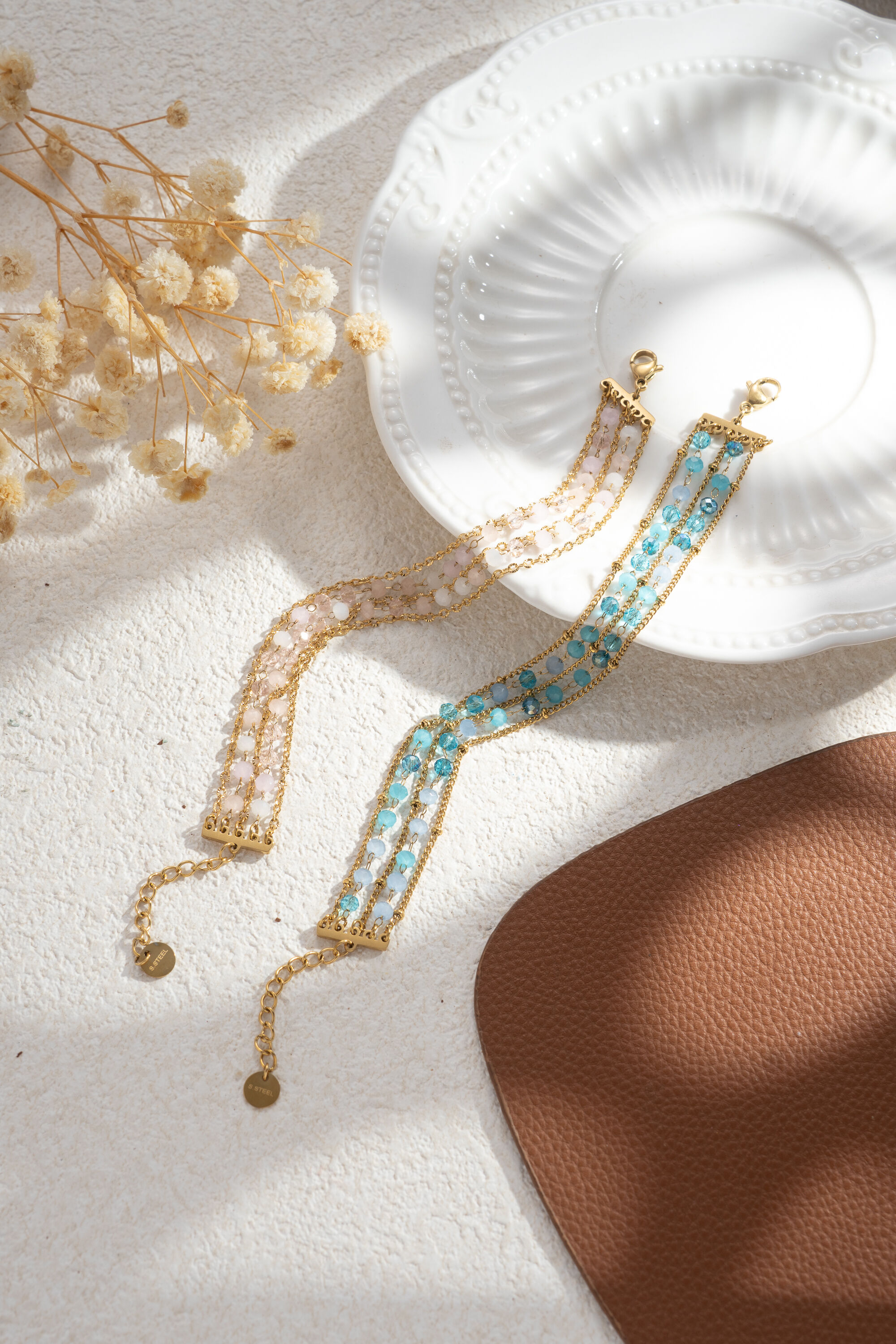 Multi-strand bracelet with pink and turquoise beads in stainless steel