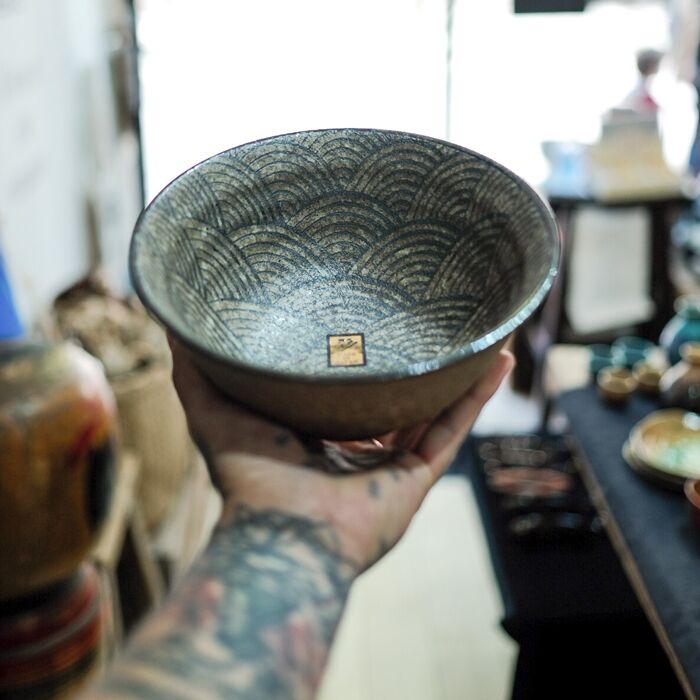 Ramen Bowl with Wave Design on Inside, Brown Background