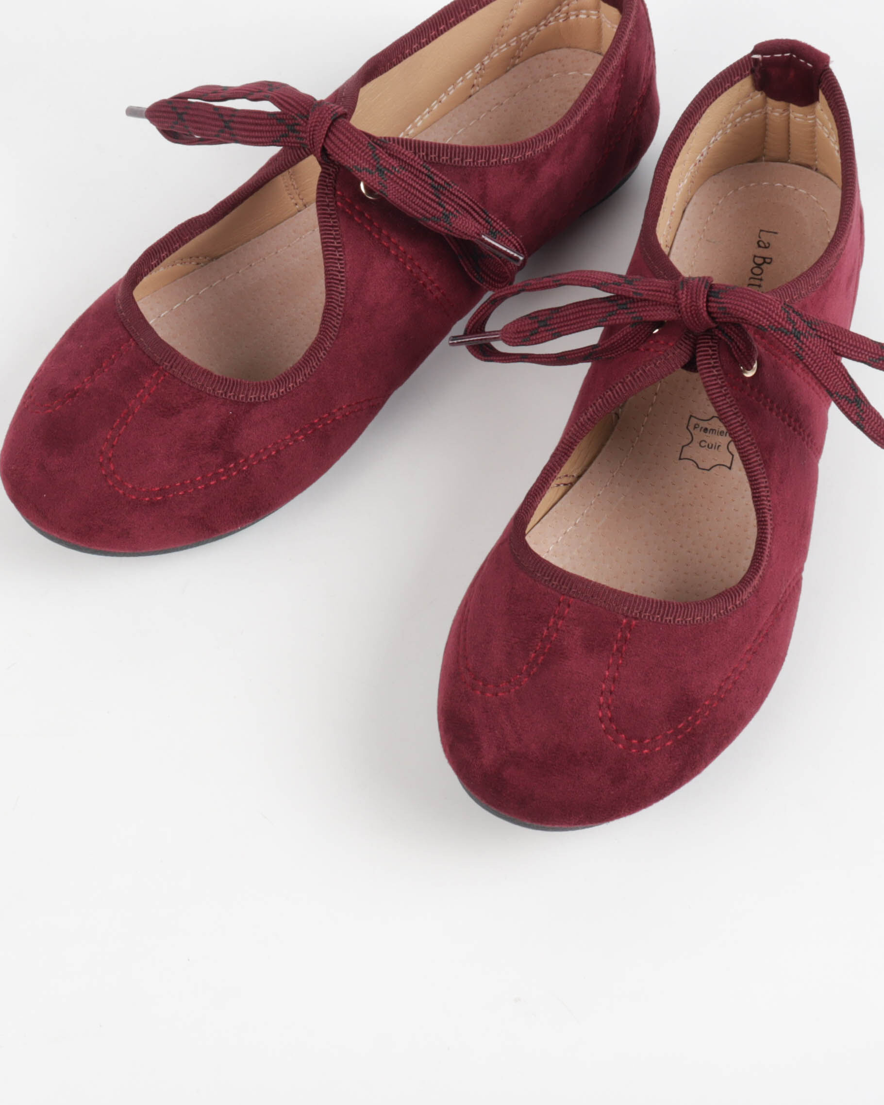 Women's flat lace-up shoes with a suede-like finish and topstitching