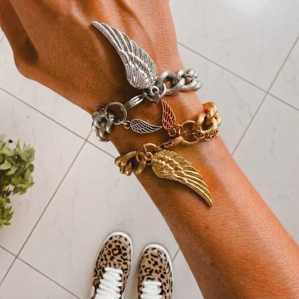 Bracciale con ciondolo a forma di ala d'angelo in oro e argento