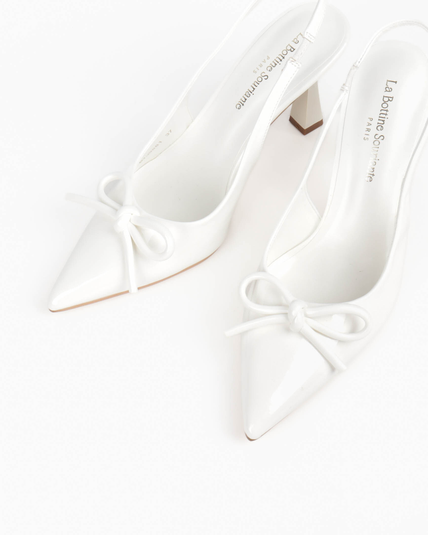 Women's slingback pumps, pointed toe, patent finish and bow detail