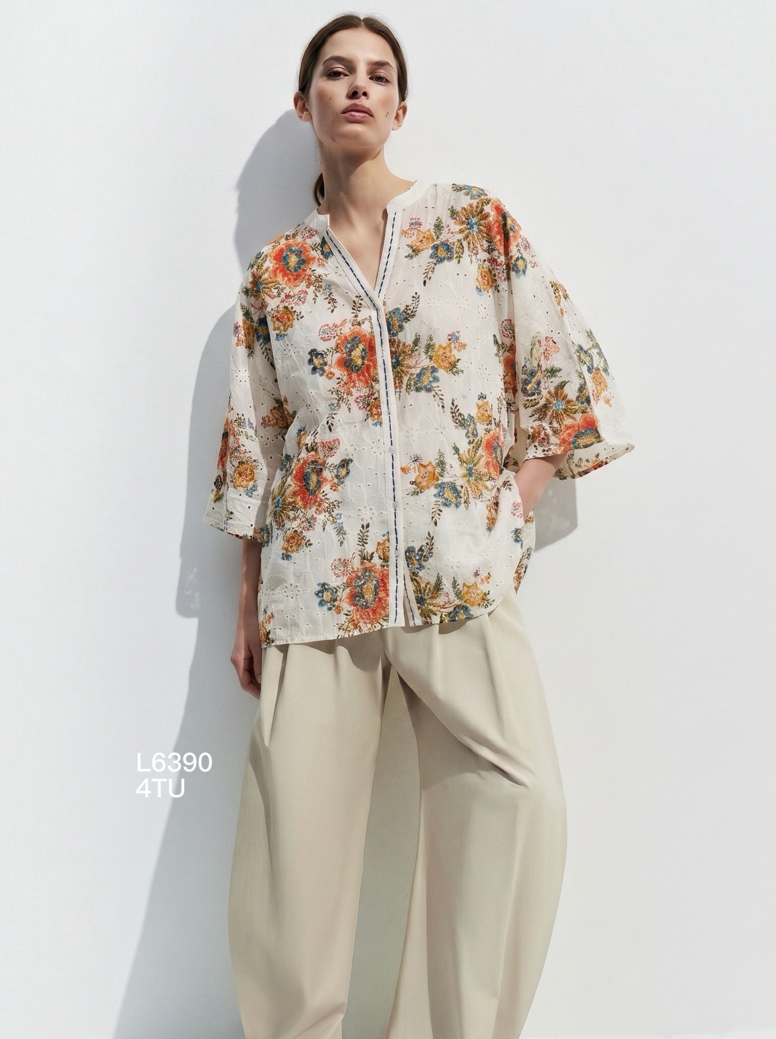 Printed blouse with three-quarter sleeves and a split neck
