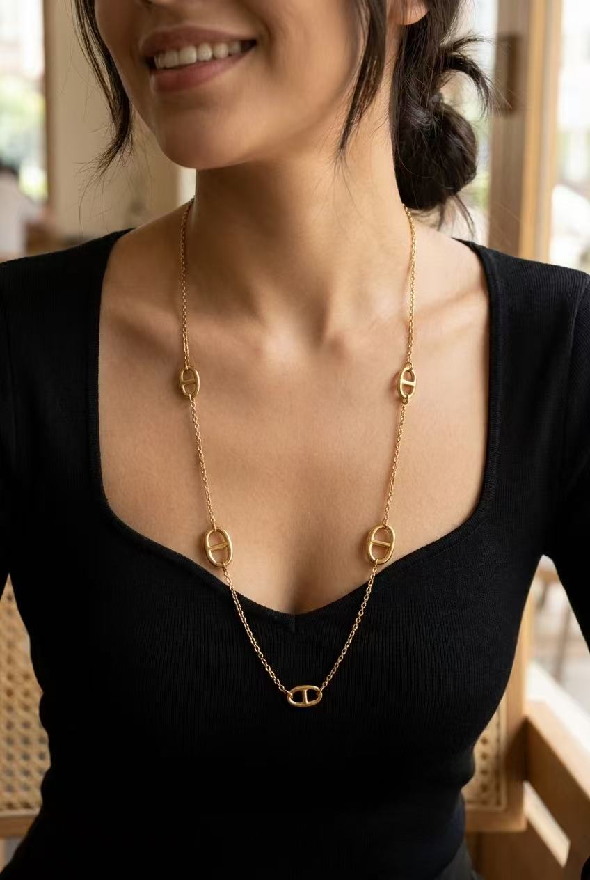 Long, elegant, modern, graphic oval link necklace in gold-plated stainless steel