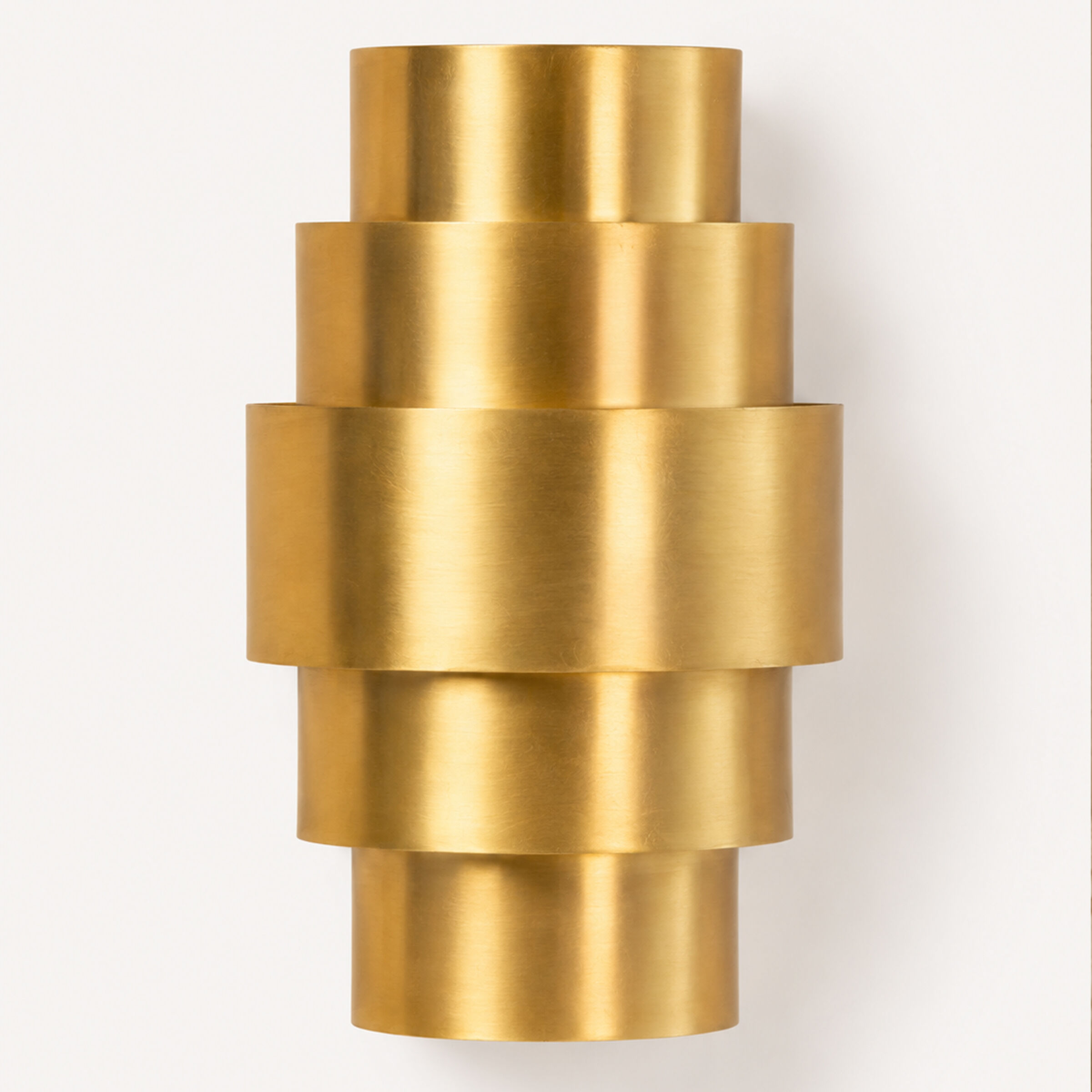 Rounded brass wall light