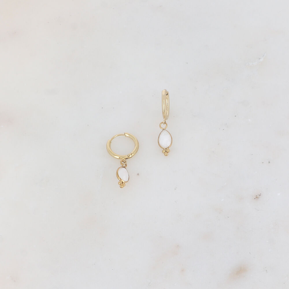 Hoop earrings with a teardrop-shaped natural stone tassel