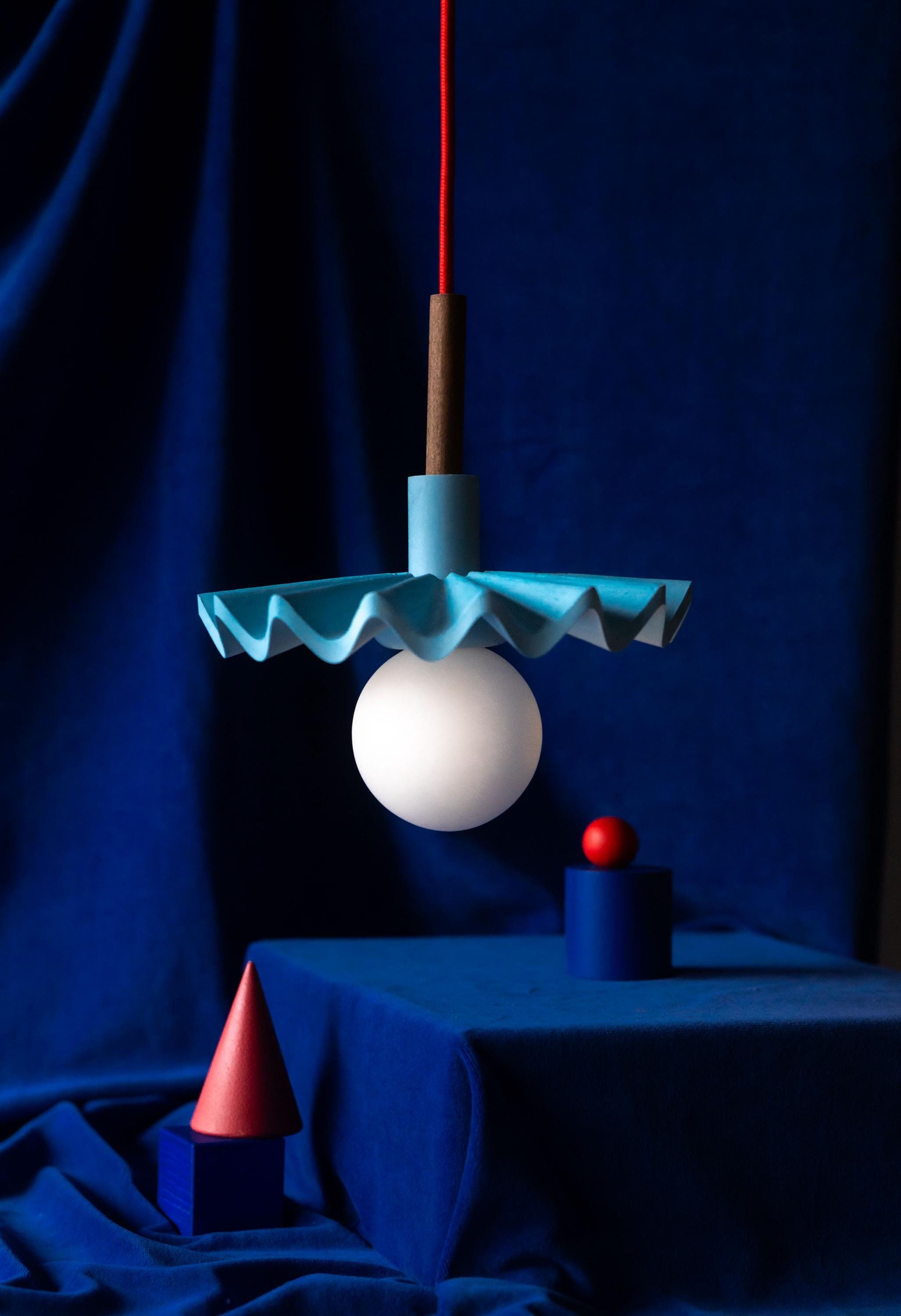 Handmade jesmonite lamp: Blue wavy lighting with red textile cord