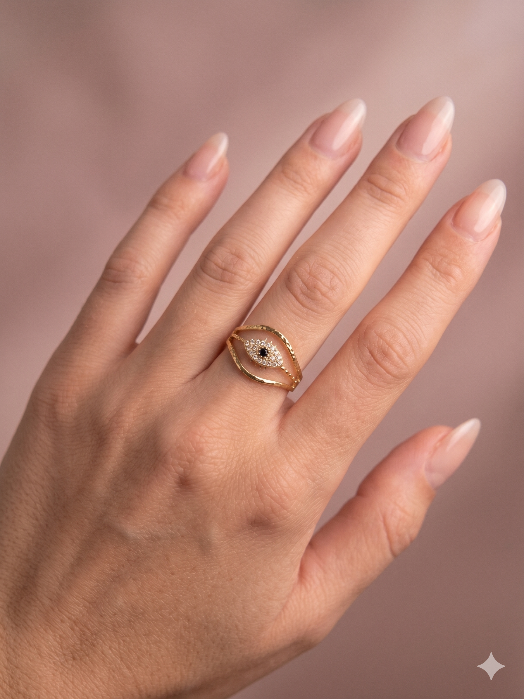 Bague dorée ajustable œil pavé de strass