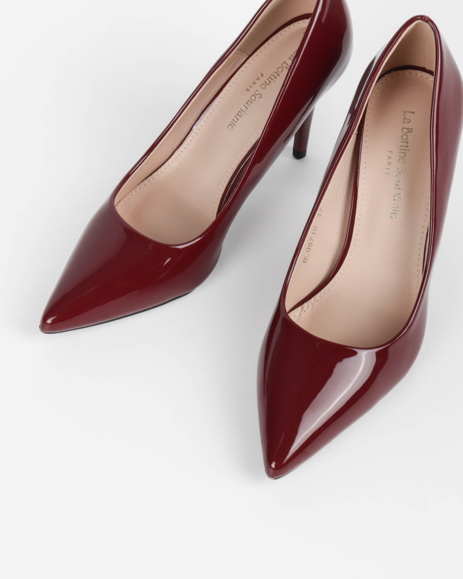 Women's pointed-toe pumps with a thin patent leather heel