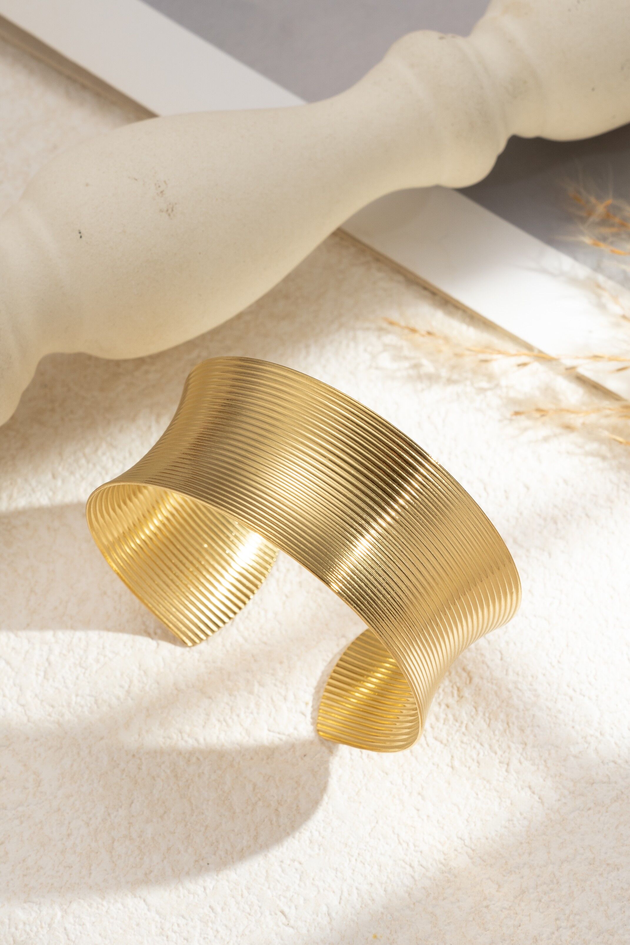 Textured gold-tone stainless steel ribbed cuff bracelet