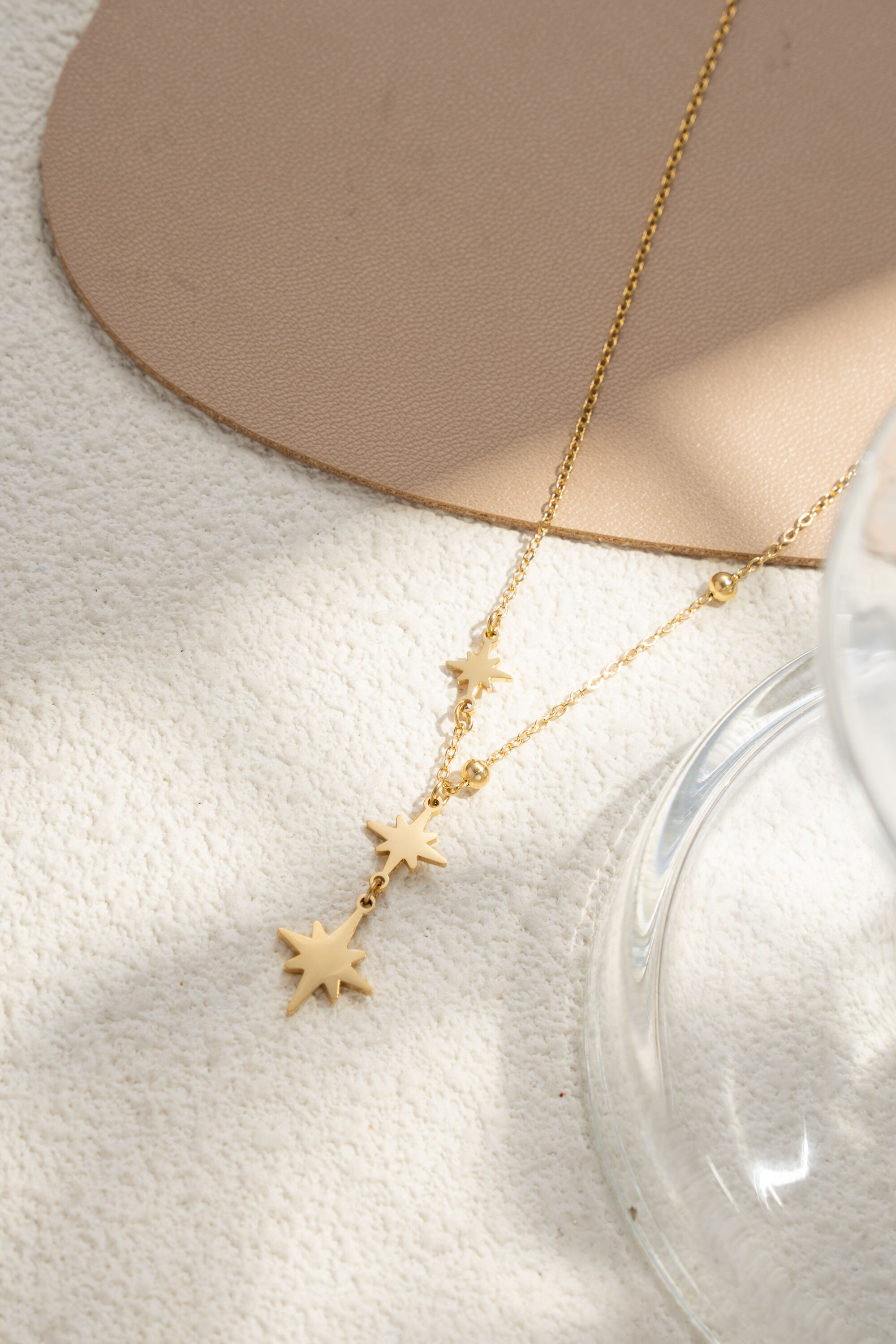 Elegant and trendy silver and gold three-star necklace in fine steel