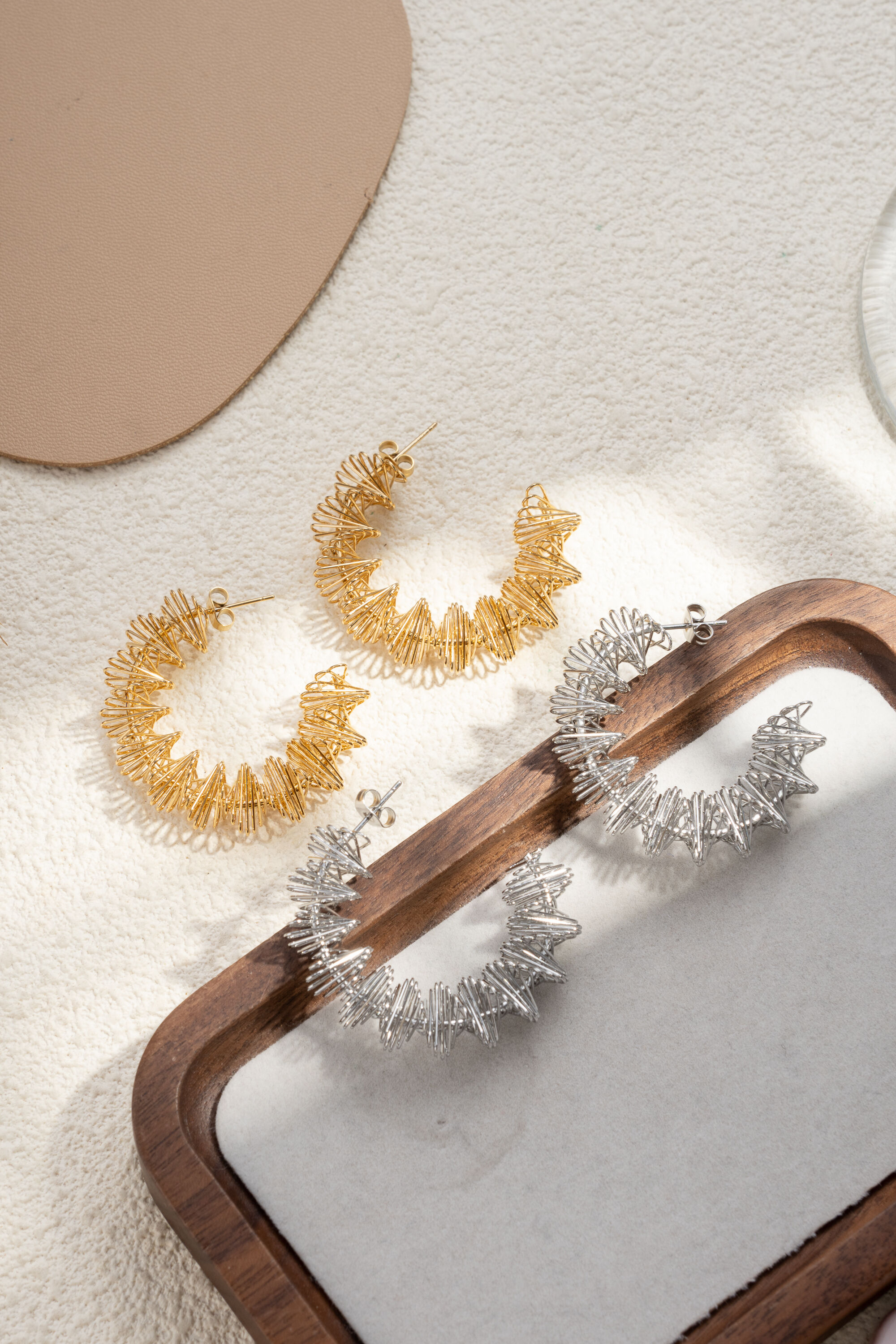 Elegant gold and silver textured steel hoop earrings for women