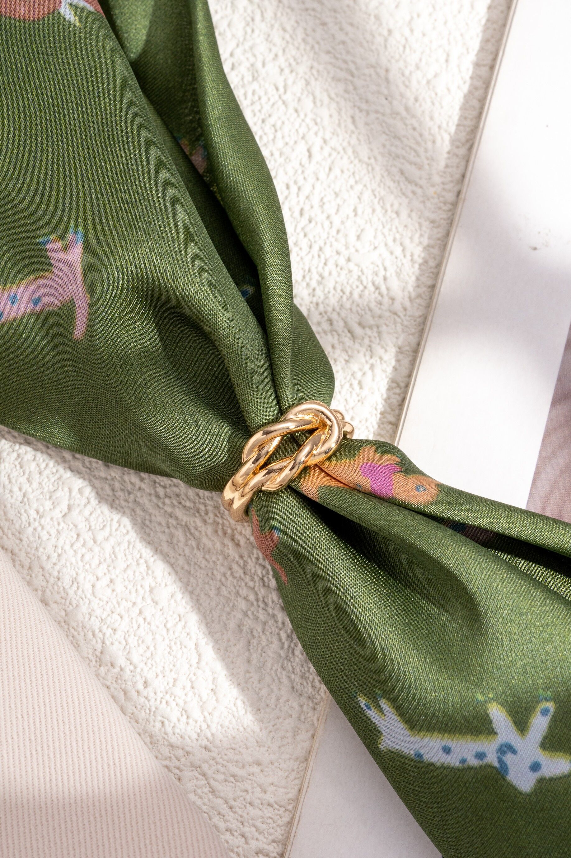 Gold and silver twisted metal scarf loop with textured ring