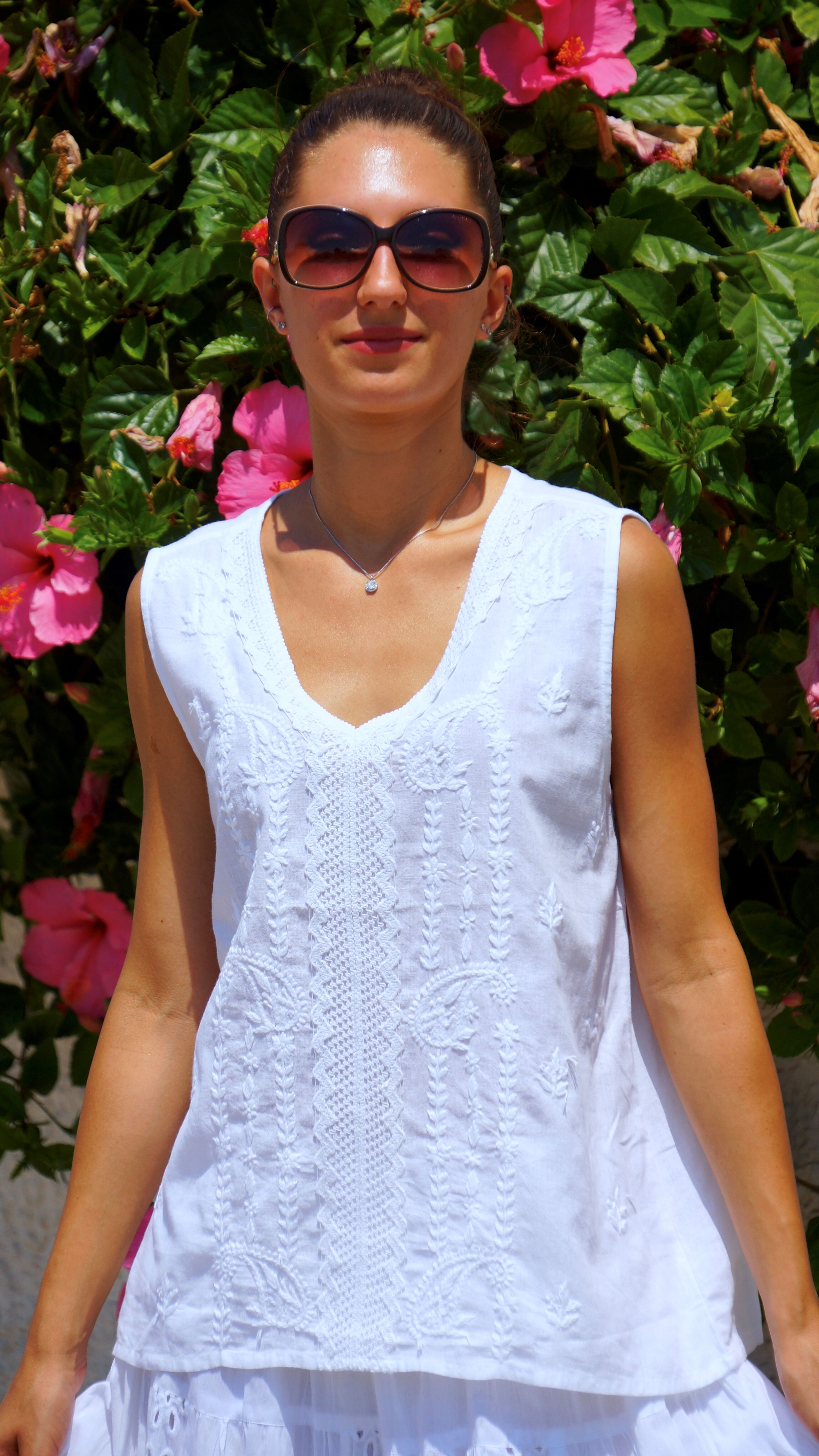 White sleeveless embroidered cotton blouse