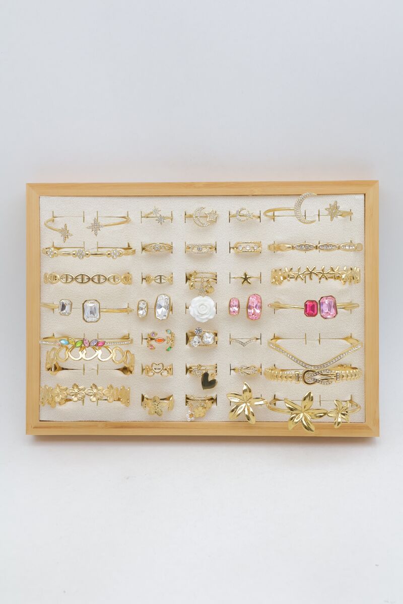 Assortment of 21 rings and 14 bangles with star, heart and flower designs