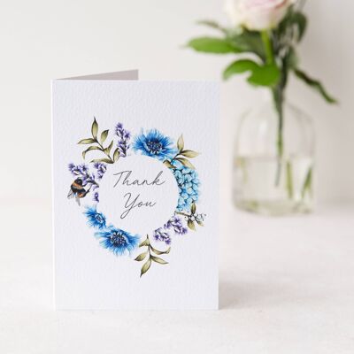Tarjeta de felicitaciones de guirnalda floral azul