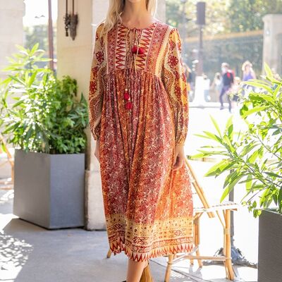 Long dress in bohemian print with pompoms