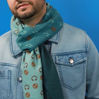 Cuddly soft cotton scarf with a music pattern in green