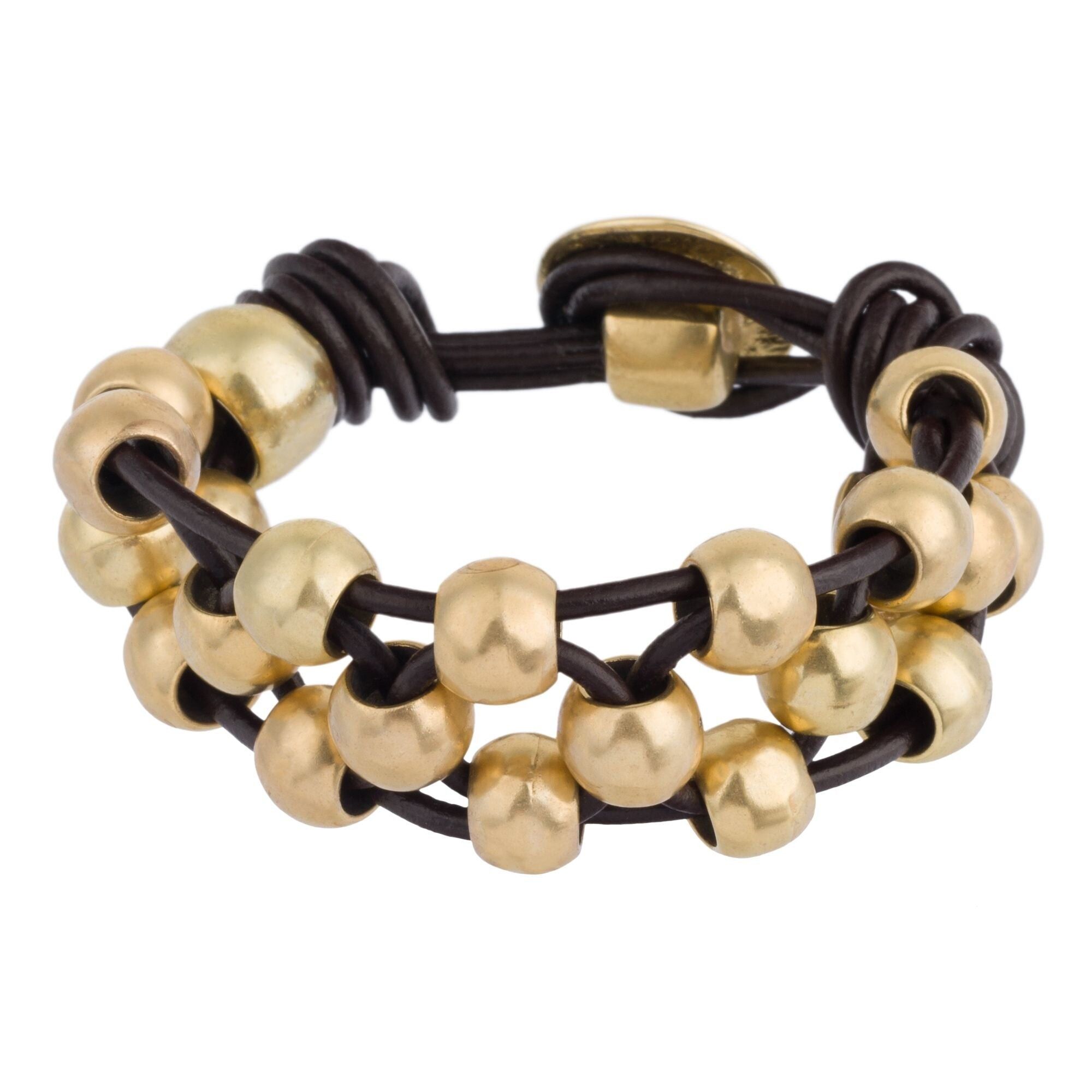 Bracciale in pelle e zama dorata con palline "Enlazado".