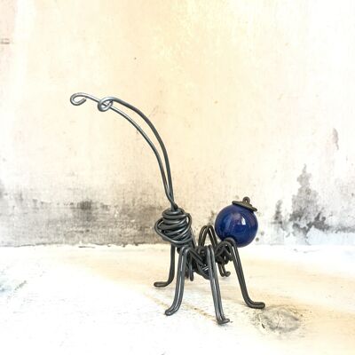 Ant with blue wooden ball
