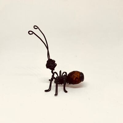 Ant with brown faceted wooden ball